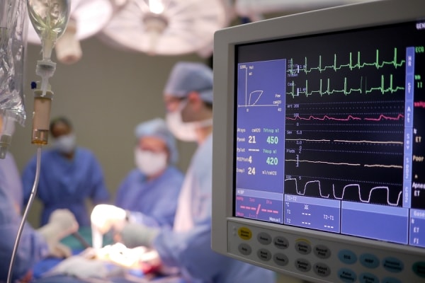 Doctor operating the patient in ICU