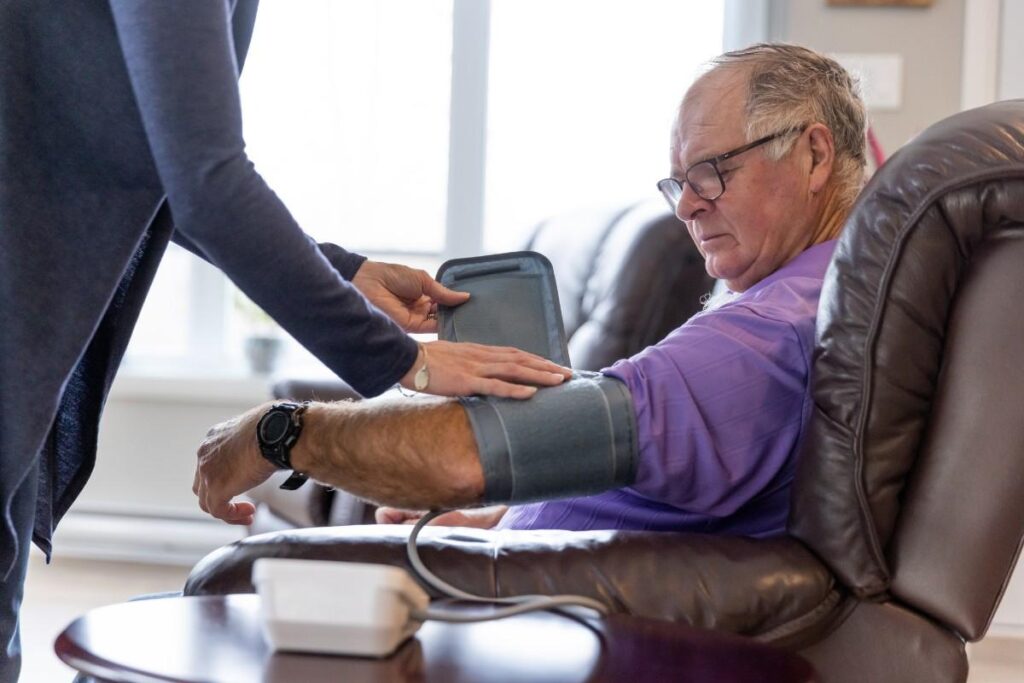 Senior Patient Reviewing Cholesterol Test Results & Heart Risk with Cardiac Solutions Cardiologist