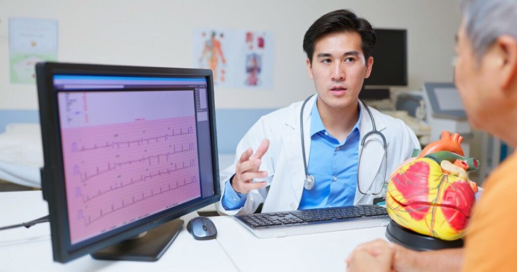 Doctor Reviewing Risk Factors to Decide If Irregular Heartbeat Needs Treatment at Cardiac Solution