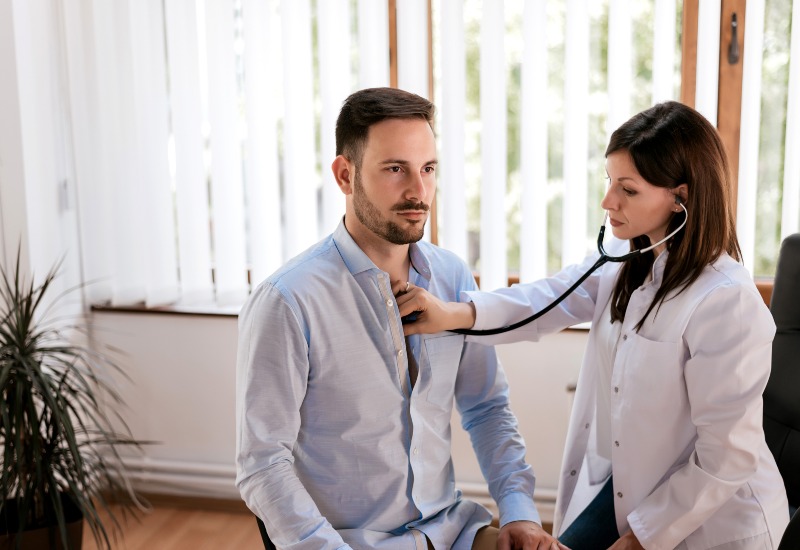 Doctor examining patient for bradycardia in Sun City, Glendale, and Peoria, AZ