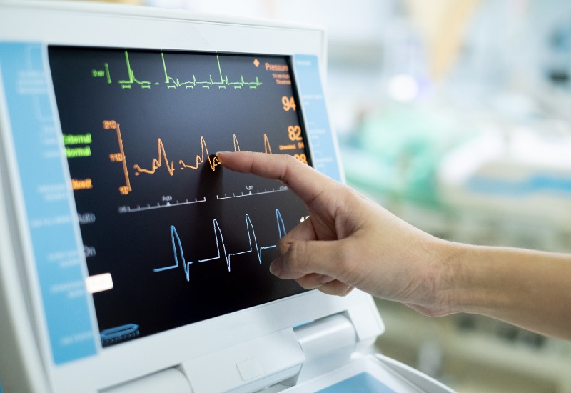 A doctor reviewing cardiac monitoring display in Sun City, Glendale, and Peoria, AZ