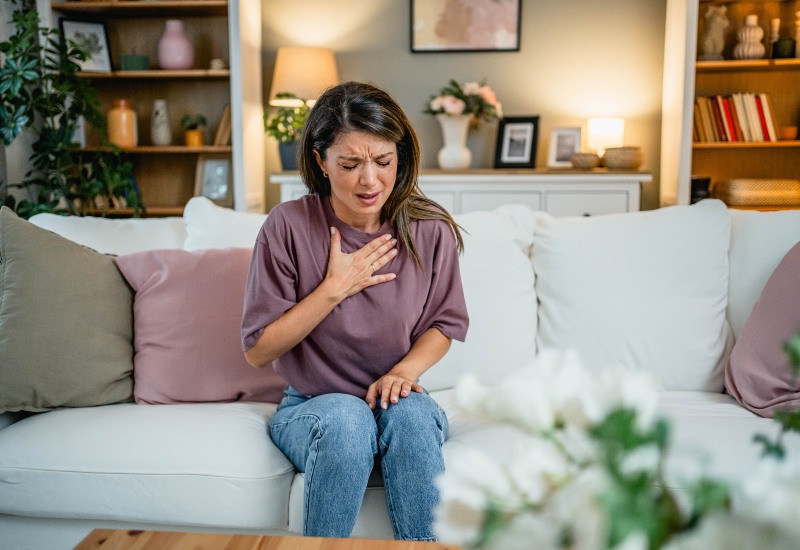 A woman with chest pain showing heart disease risk in Sun City, Glendale, and Peoria, AZ