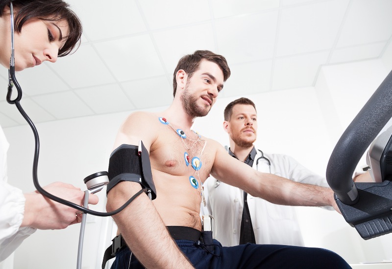 Two doctors performing stress echocardiogram test on a patient in Sun City, Glendale, and Peoria, AZ